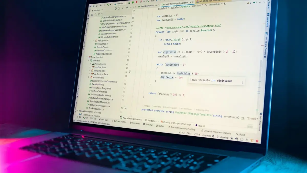 Angled laptop screen showing a code editor with a validator class and a test project tree